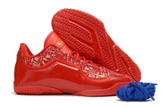 Red Nike LeBron 23 basketball shoe shown in profile beside an outsole view.