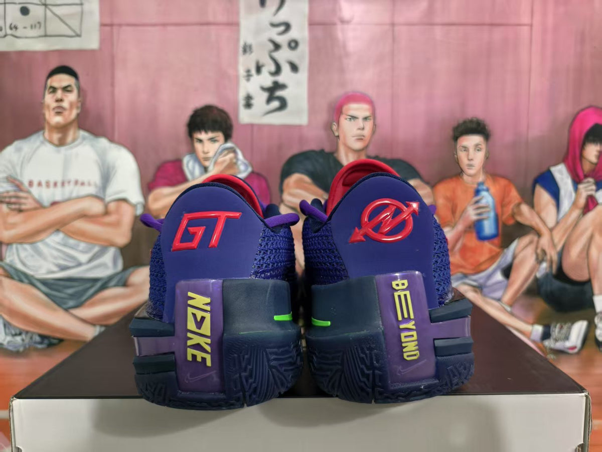 Rear view of purple Nike basketball sneakers showing contrasting heel logos, red and green accents, and a basketball-themed backdrop.