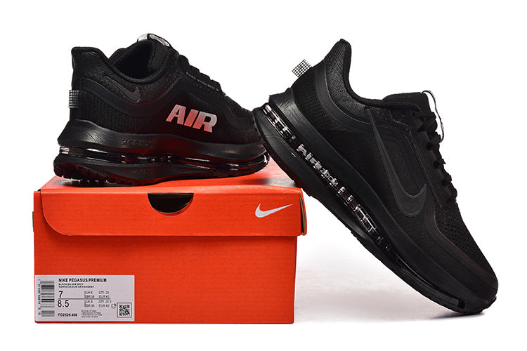 Black Nike Pegasus Premium shoes displayed on an orange Nike box; the box label shows a sample size.