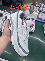 Angled view of a white and grey Nike sneaker with red accents; image text states sizes 36–50.