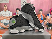 Angled view of the pair highlighting the perforated side panels, grey overlays, and contrasting white and black sole.