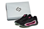 Black and pink basketball shoes displayed beside a light-colored branded shoe box.