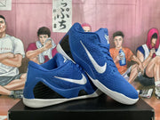 Pair of blue basketball shoes with white side logos, black side panels, and white outsoles.