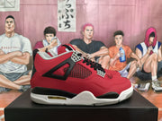 Side view showing the red upper, black structural panels, mesh inserts, and layered white-and-black sole.