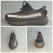 Composite product image showing side, top, and rear views of the black reflective sneakers.