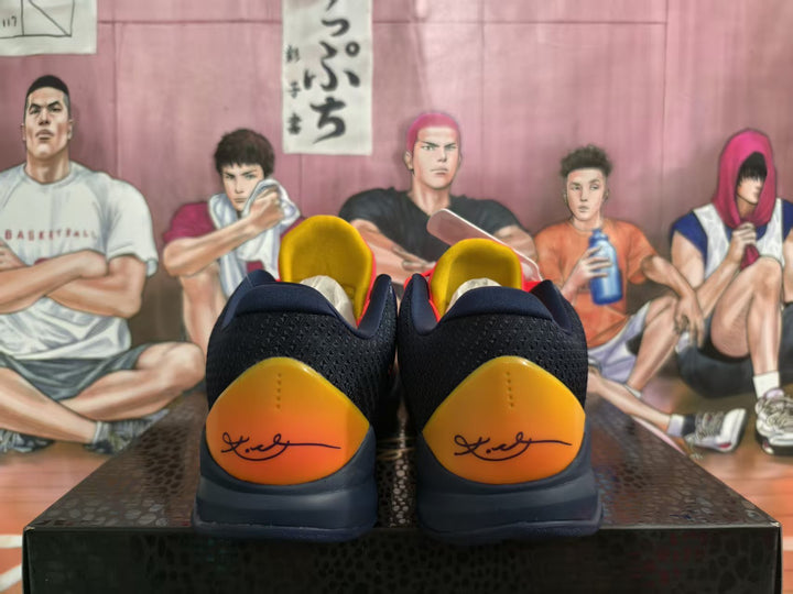 Rear view of navy basketball sneakers with orange-yellow heel panels and a dark outsole, photographed against an illustrated basketball-themed backdrop.