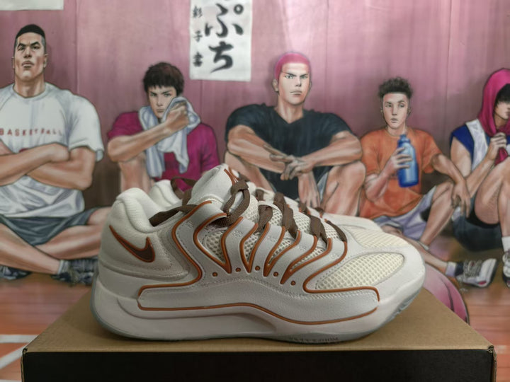 Side view of white Nike sneakers with orange-brown detailing and brown laces on a box
