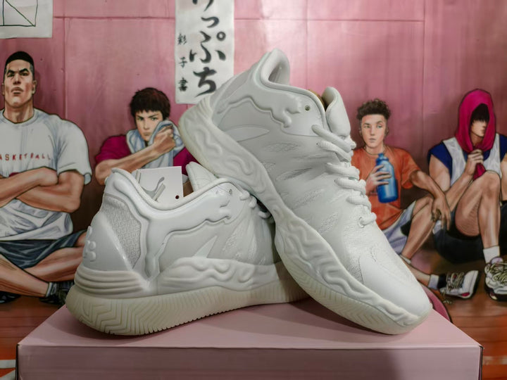 White basketball sneakers shown from the side and at an angle