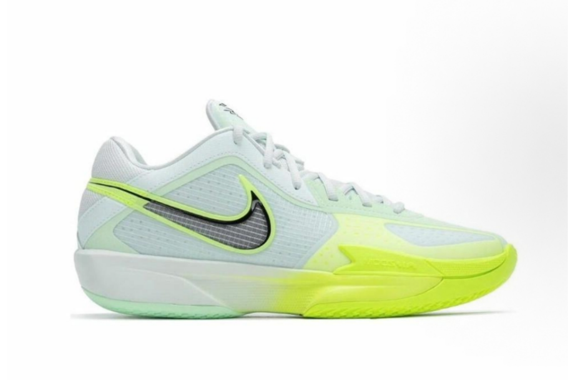 Side view of white low-top sneakers with pale green panels, neon yellow accents, a contrasting side Swoosh-style logo and a textured outsole.