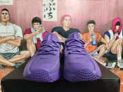 Front view of purple Nike low-top sneakers with lace-up fastening and textured toe areas.