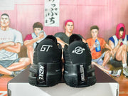 Rear view showing GT lettering and heel details on black Nike GT sneakers.