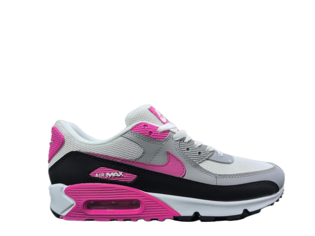 Side view of a white and grey Nike Air Max sneaker with pink accents, black overlays and a visible heel Air unit.