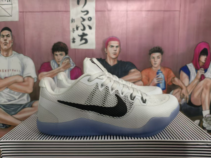 White Nike basketball shoe with black side logo and translucent blue outsole, shown from the side.