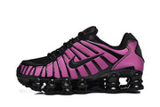 Side view of a purple and black Nike Shox TL sneaker showing its mesh toe and column-shaped sole details.