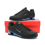 Black and blue Nike Shox Z R2 sneakers displayed on a red shoe box