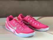 Front three-quarter view of the pink and silver lace-up basketball sneakers.