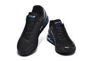 Front view of a pair of black Nike sneakers with blue tongue accents.