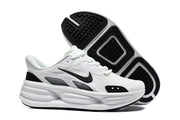 White Nike sneaker shown beside its black-and-white outsole