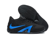 Black sneaker outsole and side view showing the textured tread