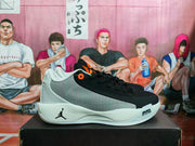 Side profile showing the black forefoot, gray patterned side panel, Jordan logo, white midsole, and Air Zoom marking.