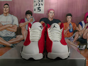 Front view showing white toe panels, red side sections, white laces, and visible Jumpman logos.