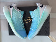 Overhead view of the paired sneakers placed on a black basketball shoe box.