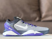 Single side profile showing the gray upper, white Swoosh, and purple outsole.