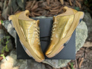 Pair of Kobe 5 shoes arranged over a dark box