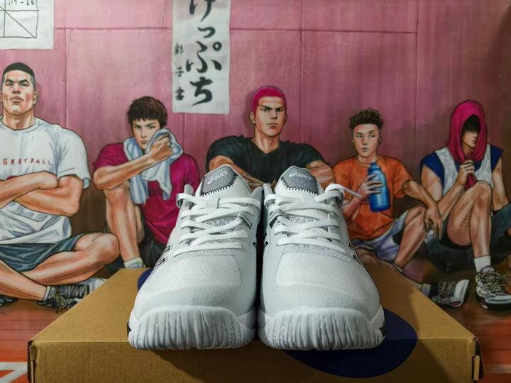 Pair of white and black ASICS basketball sneakers, viewed from the front
