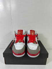 Front view of the Jordan Dub Zero sneakers showing red laces, gray toe overlays, and decorative tongue details.