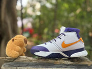 Side profile showing the high-top shape, orange swoosh, purple outsole accents and number 8 detail.