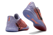 Lavender and coral Nike Sabrina 3 shoes shown from the heel and outsole