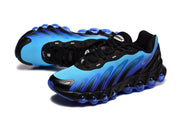Angled view of the blue and black sneakers showing the upper, laces, and sole.