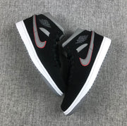 Top-down view of the pair showing black laces, grey collars and contrasting Swoosh details.