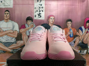 Front view of pink Nike basketball shoes with pink laces and matching toe and outsole accents.