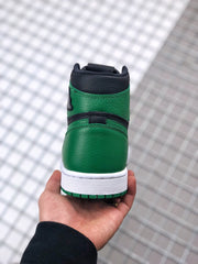 Rear close-up showing the green heel panel, black collar, white midsole, and green outsole.