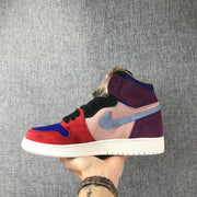 Outer side profile showing the red toe and eyestay, pink quarter panel, light blue side logo, and purple heel.