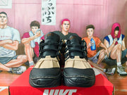 Front view of the pair showing black laces, khaki panels, and sculpted toes.
