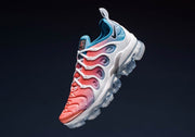 Angled full view of the sneaker with pink upper, white supports, and blue heel accents