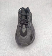 Top view showing the laces, tongue, layered toe area, and textured upper.
