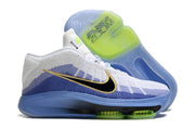 White and blue Nike GT Hustle 3 side view with black and gold Swoosh details and lime outsole accents.