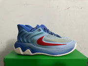 Side view of a blue Nike high-top sneaker with a red swoosh and layered midsole