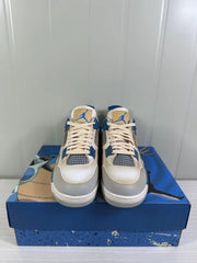 Front view of the pair showing the white toe boxes, blue lace supports, and mesh panels.