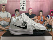 Side view of a white Nike basketball sneaker showing the black swoosh, perforated upper, patterned forefoot overlay and ZoomX midsole branding.