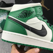 Close-up of the ankle logo detail, green textured overlay, and black side detail.
