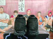 Rear view of black Nike LeBron shoes showing heel details and patterned soles