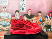 Side view showing the red upper, dark patterned panel, Nike Swoosh, laces, and textured outsole.