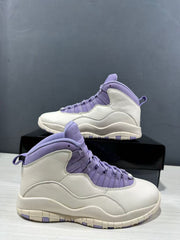 Two white and purple high-top sneakers shown from front and side angles.