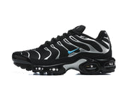 Side profile of a black and silver Nike Air Max Plus sneaker