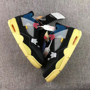 Top view showing the black sneakers, white mesh side panels, translucent side pieces, and yellow-toned soles.